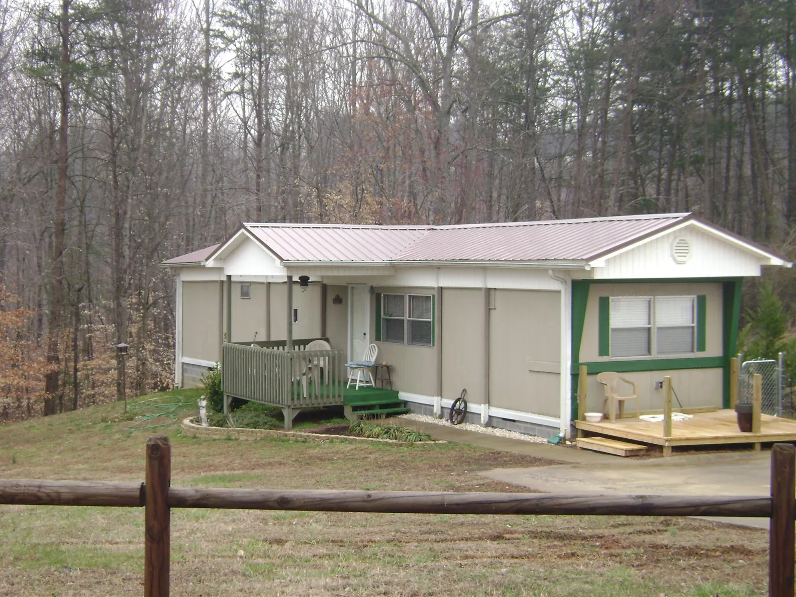 Mauve metal roof on a manufactured home with a new front deck in Brunswick